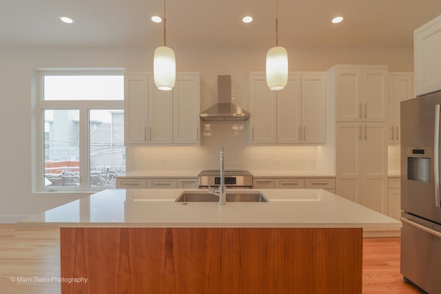 6123 S Ellis Ave, Chicago, IL 60637 - kitchen with wall chimney range hood, stainless steel refrigerator with ice dispenser, light countertops, healthy amount of natural light, and recessed lighting