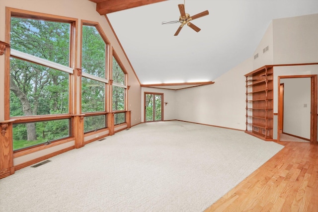 9316 Pine Needle Pass, Bull Valley, IL 60097 - unfurnished living room with vaulted ceiling, plenty of natural light, ceiling fan, and wood finished floors