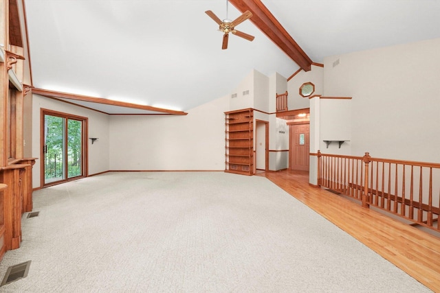 9316 Pine Needle Pass, Bull Valley, IL 60097 - unfurnished living room featuring a ceiling fan, beamed ceiling, high vaulted ceiling, wood finished floors, and carpet