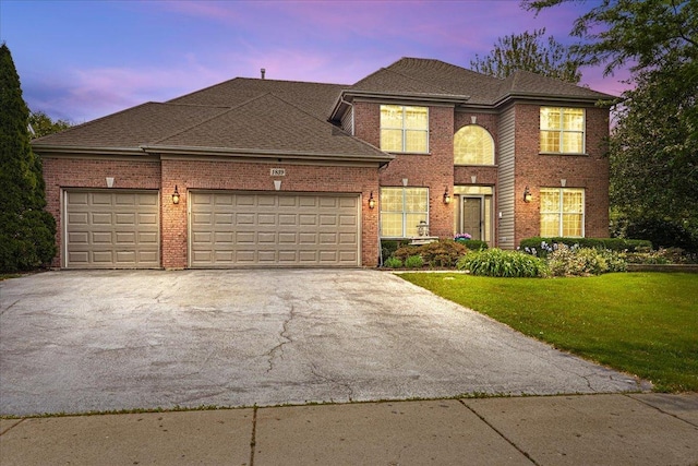 1839 Kings Gate Ln, Crystal Lake, IL 60014 - traditional-style home with driveway, an attached garage, a front yard, and brick siding