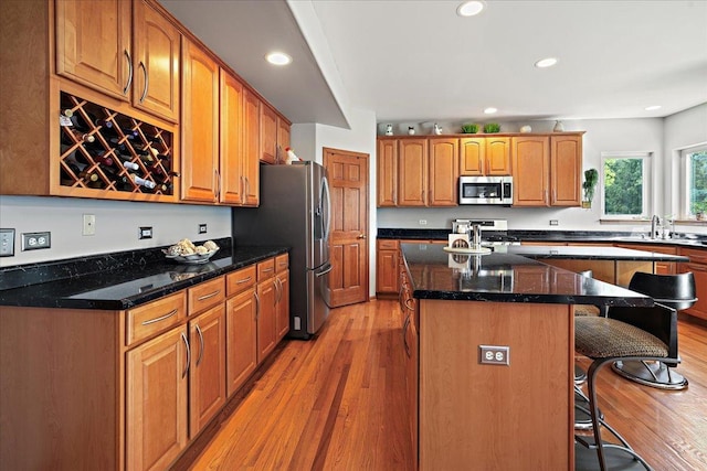 1839 Kings Gate Ln, Crystal Lake, IL 60014 - kitchen featuring stainless steel appliances, a breakfast bar area, light wood-type flooring, a center island, and recessed lighting