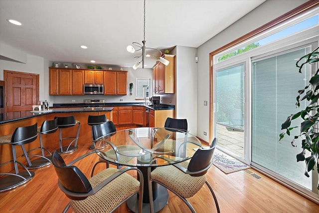 1839 Kings Gate Ln, Crystal Lake, IL 60014 - dining room with light wood-style floors, recessed lighting, and a chandelier