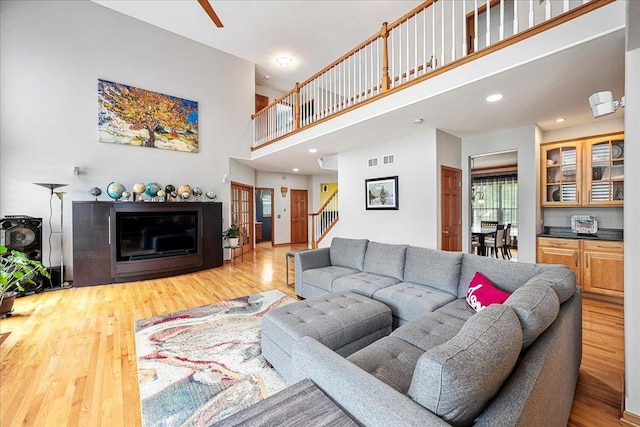 1839 Kings Gate Ln, Crystal Lake, IL 60014 - living room featuring stairway, wood finished floors, a high ceiling, a ceiling fan, and recessed lighting