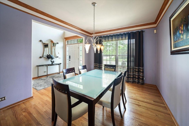 1839 Kings Gate Ln, Crystal Lake, IL 60014 - dining room with light wood-type flooring, baseboards, and crown molding