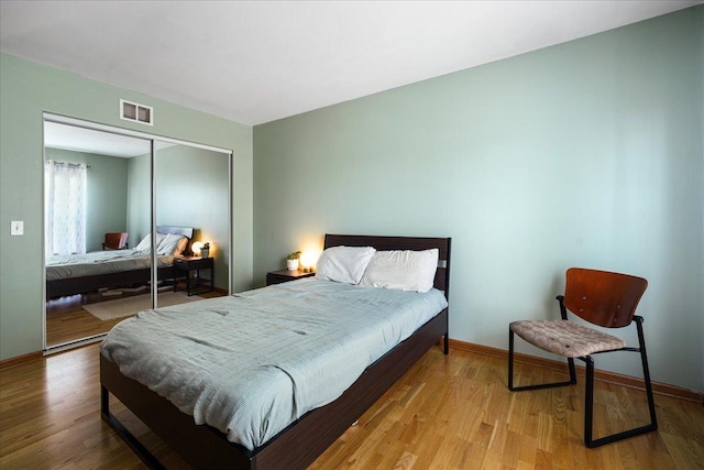 1839 Kings Gate Ln, Crystal Lake, IL 60014 - bedroom featuring a closet, wood finished floors, and baseboards