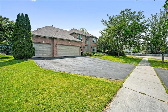 1839 Kings Gate Ln, Crystal Lake, IL 60014 - view of front of home featuring a garage, driveway, and brick siding