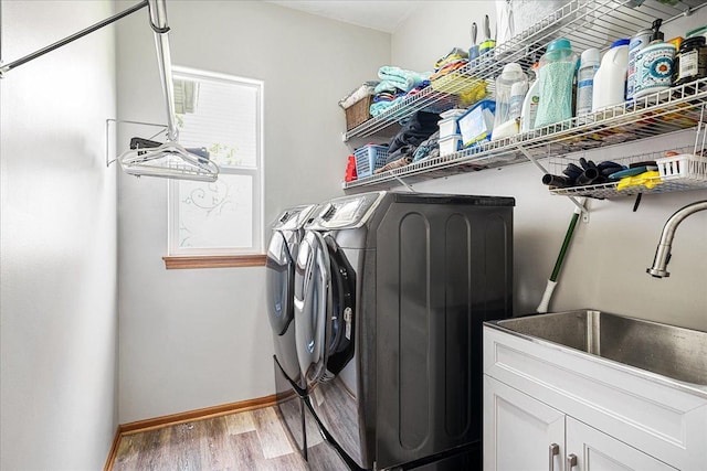 1839 Kings Gate Ln, Crystal Lake, IL 60014 - laundry room with independent washer and dryer, cabinet space, light wood-style flooring, and baseboards