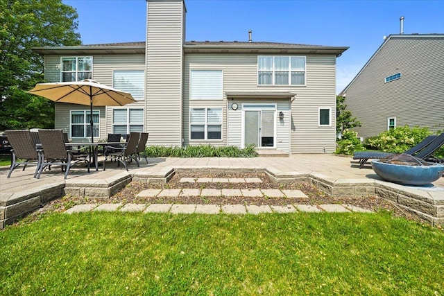 1839 Kings Gate Ln, Crystal Lake, IL 60014 - rear view of property featuring a patio area, an outdoor fire pit, a chimney, and a lawn