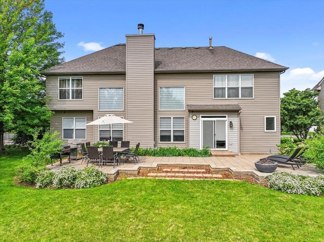 1839 Kings Gate Ln, Crystal Lake, IL 60014 - rear view of property with an outdoor fire pit, a patio, and a lawn