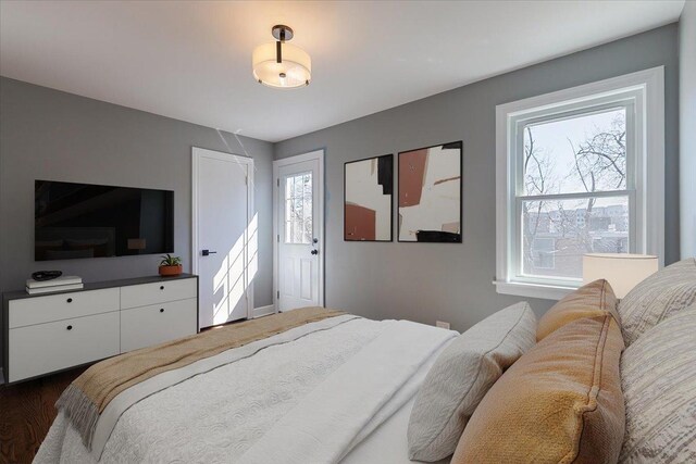 7241 N Kilpatrick Ave, Lincolnwood, IL 60712 - bedroom with multiple windows and dark wood finished floors