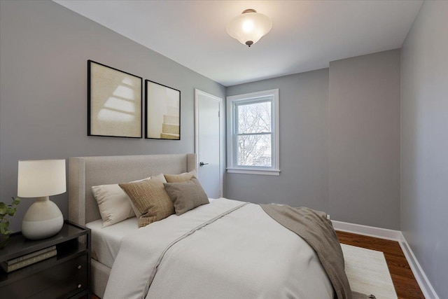7241 N Kilpatrick Ave, Lincolnwood, IL 60712 - bedroom with dark wood-style floors and baseboards