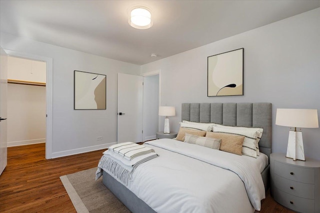 7241 N Kilpatrick Ave, Lincolnwood, IL 60712 - bedroom featuring baseboards, wood finished floors, and a spacious closet