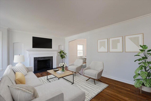 7241 N Kilpatrick Ave, Lincolnwood, IL 60712 - living area with crown molding, wood finished floors, baseboards, arched walkways, and a fireplace with flush hearth