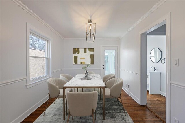 7241 N Kilpatrick Ave, Lincolnwood, IL 60712 - dining room with dark wood-style flooring, ornamental molding, and baseboards