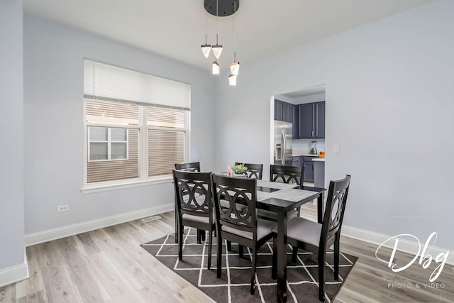 1943 Lily Ln, Round Lake, IL 60073 - dining area featuring baseboards and light wood-type flooring