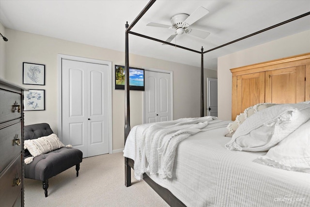 506 Taylor Ave Unit A, Glen Ellyn, IL 60137 - bedroom featuring light carpet, multiple closets, and ceiling fan