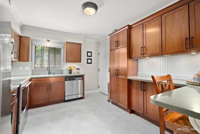 506 Taylor Ave Unit A, Glen Ellyn, IL 60137 - kitchen with stainless steel appliances, a sink, ornamental molding, brown cabinetry, and light countertops
