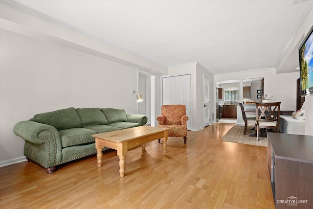 506 Taylor Ave Unit A, Glen Ellyn, IL 60137 - living area with light wood finished floors, crown molding, and baseboards