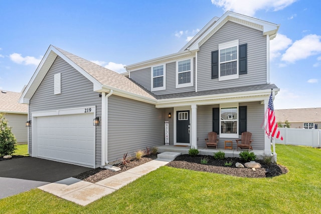 219 Conway St, Elburn, IL 60119 - traditional-style house featuring a porch, a garage, asphalt driveway, and roof with shingles