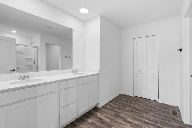 219 Conway St, Elburn, IL 60119 - bathroom with double vanity, wood finished floors, a shower, and recessed lighting