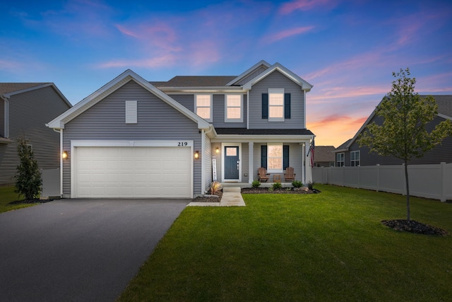 219 Conway St, Elburn, IL 60119 - view of front of house featuring asphalt driveway, a porch, and an attached garage