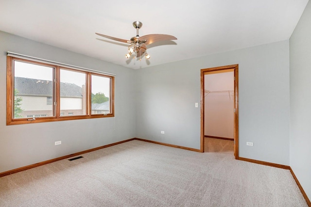 1650 Chauser Ln, Woodridge, IL 60517 - carpeted spare room with baseboards and ceiling fan