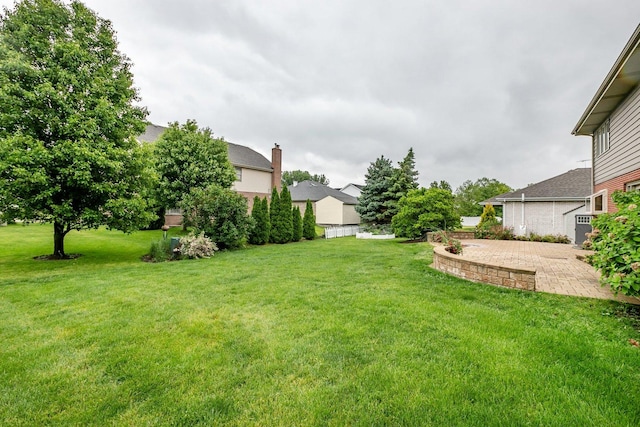 1650 Chauser Ln, Woodridge, IL 60517 - view of green lawn with a patio area