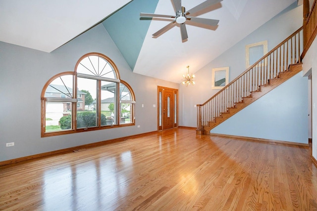 1650 Chauser Ln, Woodridge, IL 60517 - unfurnished living room featuring high vaulted ceiling, stairway, wood finished floors, and a chandelier