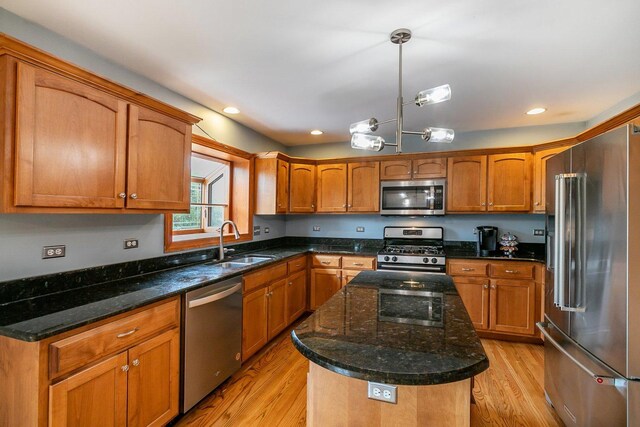 1650 Chauser Ln, Woodridge, IL 60517 - kitchen featuring appliances with stainless steel finishes, a sink, light wood finished floors, brown cabinetry, and recessed lighting