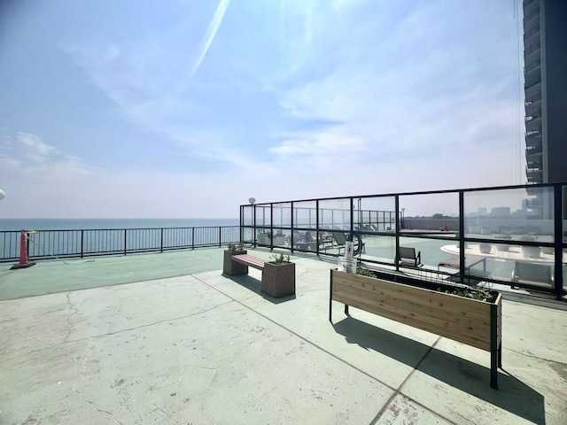 6033 N Sheridan Rd Unit 27C, Chicago, IL 60660 - view of patio featuring a water view