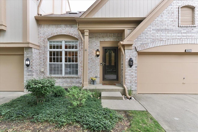 602 Cherbourg Dr, Buffalo Grove, IL 60089 - property entrance featuring concrete driveway and brick siding