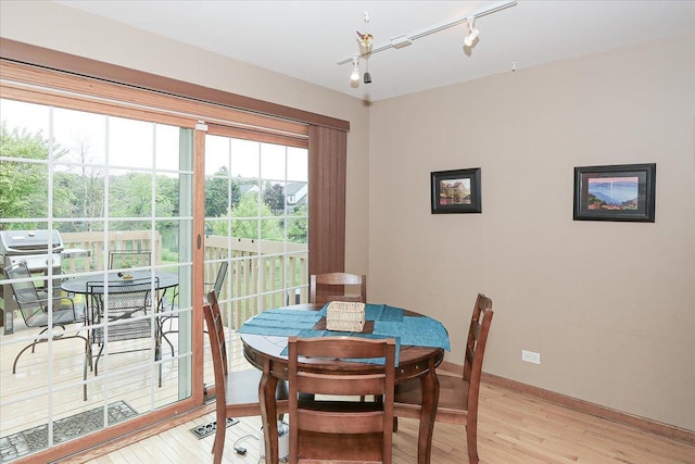 602 Cherbourg Dr, Buffalo Grove, IL 60089 - dining space with light wood finished floors and rail lighting