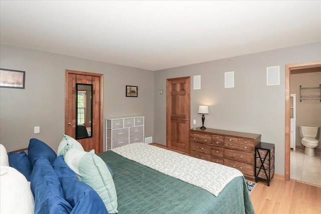 602 Cherbourg Dr, Buffalo Grove, IL 60089 - bedroom with light wood finished floors and baseboards