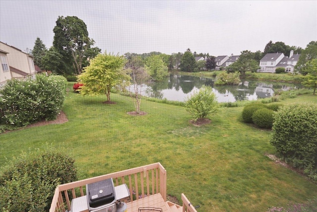 602 Cherbourg Dr, Buffalo Grove, IL 60089 - view of green lawn with a deck with water view