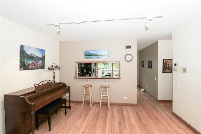 602 Cherbourg Dr, Buffalo Grove, IL 60089 - interior space featuring rail lighting and light wood-style flooring