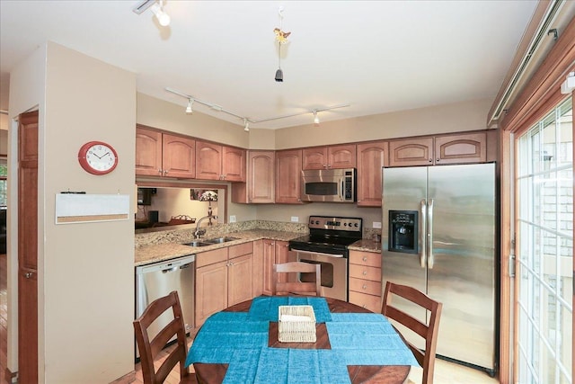 602 Cherbourg Dr, Buffalo Grove, IL 60089 - kitchen with appliances with stainless steel finishes, track lighting, and light stone countertops