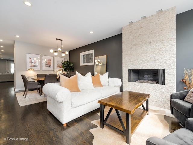 1229 N Cleaver St Unit 1, Chicago, IL 60642 - living area featuring a chandelier, wood finished floors, recessed lighting, and a fireplace