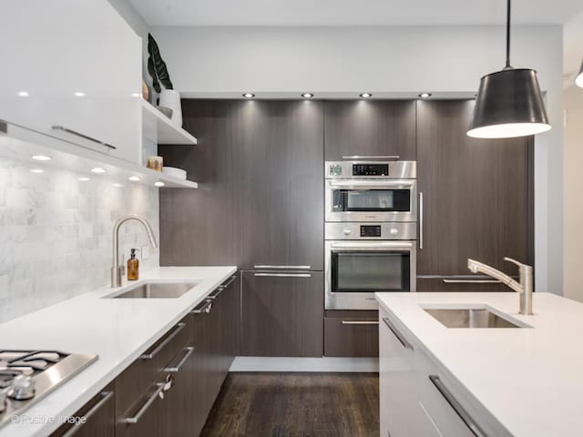 1229 N Cleaver St Unit 1, Chicago, IL 60642 - kitchen with modern cabinets, stainless steel appliances, light countertops, dark brown cabinets, and open shelves