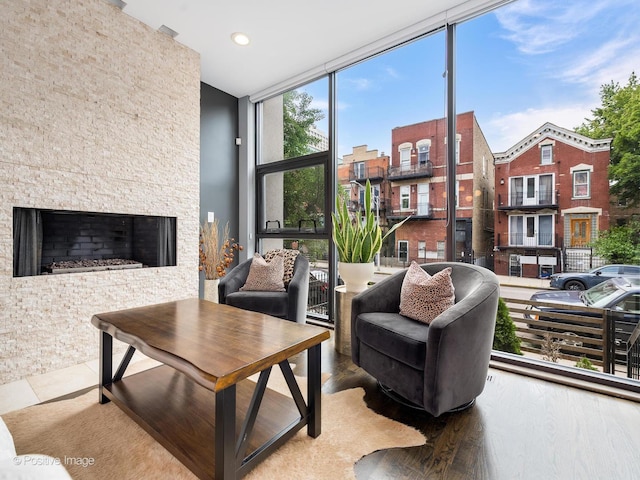 1229 N Cleaver St Unit 1, Chicago, IL 60642 - living room with a fireplace, floor to ceiling windows, recessed lighting, and wood finished floors