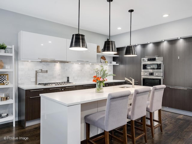 1229 N Cleaver St Unit 1, Chicago, IL 60642 - kitchen featuring modern cabinets, open shelves, appliances with stainless steel finishes, light countertops, and recessed lighting