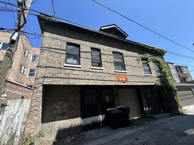 6714 S Paxton Ave, Chicago, IL 60649 - view of front of property featuring brick siding and a garage