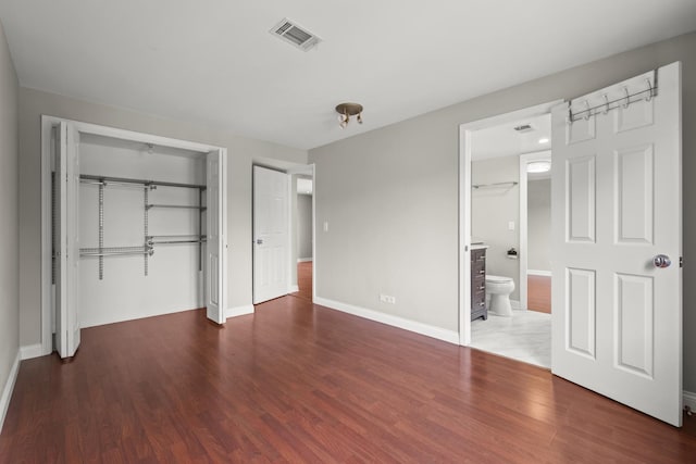 5332 N Delphia Ave Unit 108, Chicago, IL 60656 - unfurnished bedroom with wood finished floors, a closet, baseboards, and ensuite bath