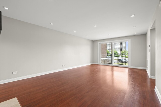 5332 N Delphia Ave Unit 108, Chicago, IL 60656 - unfurnished room with wood finished floors, baseboards, and recessed lighting