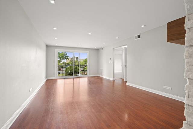 5332 N Delphia Ave Unit 108, Chicago, IL 60656 - unfurnished living room featuring wood finished floors, baseboards, a stone fireplace, and recessed lighting