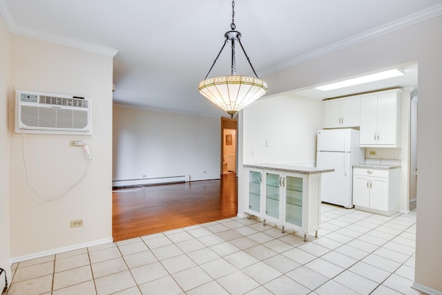 43 N Main St Unit 12, Glen Ellyn, IL 60137 - kitchen featuring freestanding refrigerator, a wall unit AC, a baseboard heating unit, crown molding, and pendant lighting