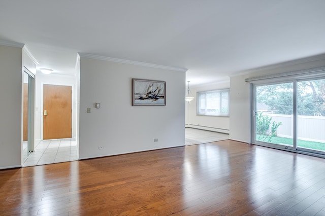 43 N Main St Unit 12, Glen Ellyn, IL 60137 - empty room with a baseboard radiator, ornamental molding, light wood finished floors, and healthy amount of natural light