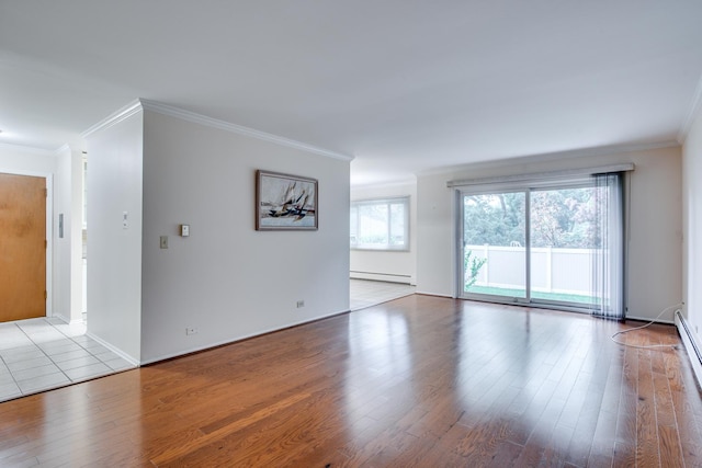 43 N Main St Unit 12, Glen Ellyn, IL 60137 - unfurnished room with a baseboard heating unit, ornamental molding, wood finished floors, baseboards, and baseboard heating