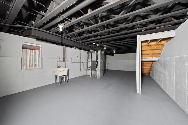 4513 S Wood St, Chicago, IL 60609 - unfinished basement featuring heating unit and a sink