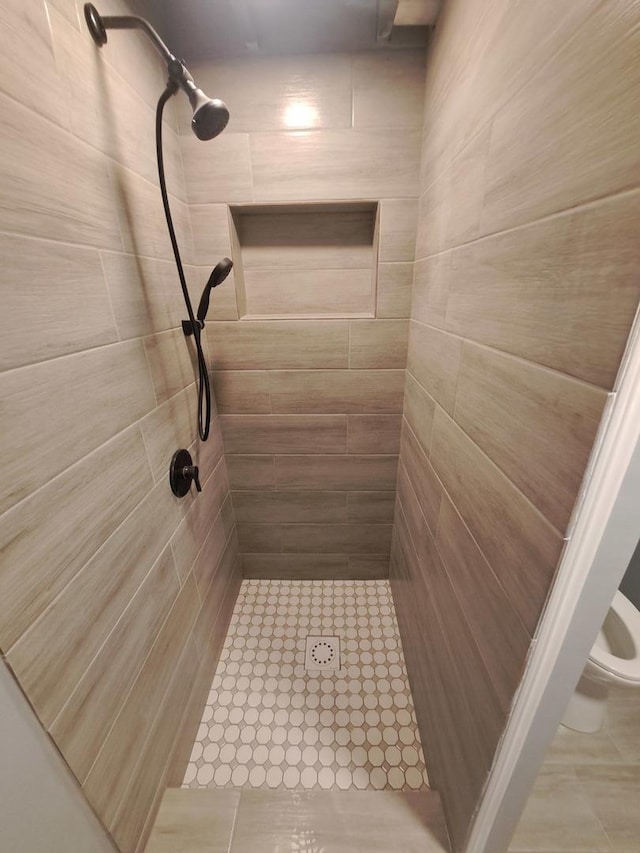 3025 Central Ave, Rockford, IL 61102 - bathroom featuring tiled shower and toilet