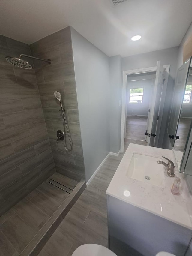 3025 Central Ave, Rockford, IL 61102 - bathroom with walk in shower, vanity, toilet, and baseboards